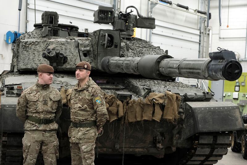 British soldiers pictured with a Challenger 2 battle tank in Estonia. The UK is set to give Ukraine 14 Challengers. EPA