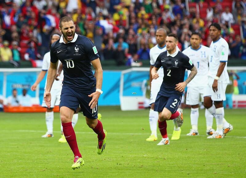 Karim Benzema of France celebrates scoring his team's first goal on a penalty kick against Honduras on Sunday at the 2014 World Cup. Ian Walton / Getty Images