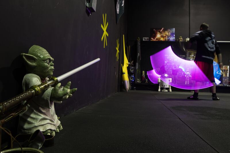 SYDNEY, AUSTRALIA - JUNE 27:  A peice Yoda memoribilla is seen as students take part in a training class at the Sons of Obiwan Saber Academy on June 27, 2017 in Sydney, Australia. The Sons of Obiwan Saber Academy is a volunteer organisation of Star Wars fans who use stage combat as a way to promote fun, fitness and education. The Australian designed and manufactured lightsabers used in classes are made from aluminium with poly-carbonate blades.  (Photo by Mark Kolbe/Getty Images)