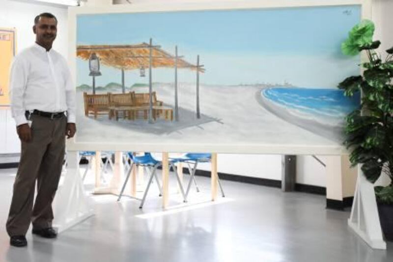 December 14, 2011, Abu Dhabi, UAE:

TDIC arranged an art competition for labourers living on Saadiyat island. Today the winners' works of art were unveiled. 

Muhammed Ali, the 1st place winner, stands next to his work of art.


Lee Hoagland/The National