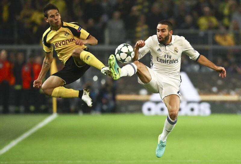 Borussia Dortmund’s Raphael Guerreiro and Real Madrid’s Dani Carvajal in action. Kai Pfaffenbach / Reuters