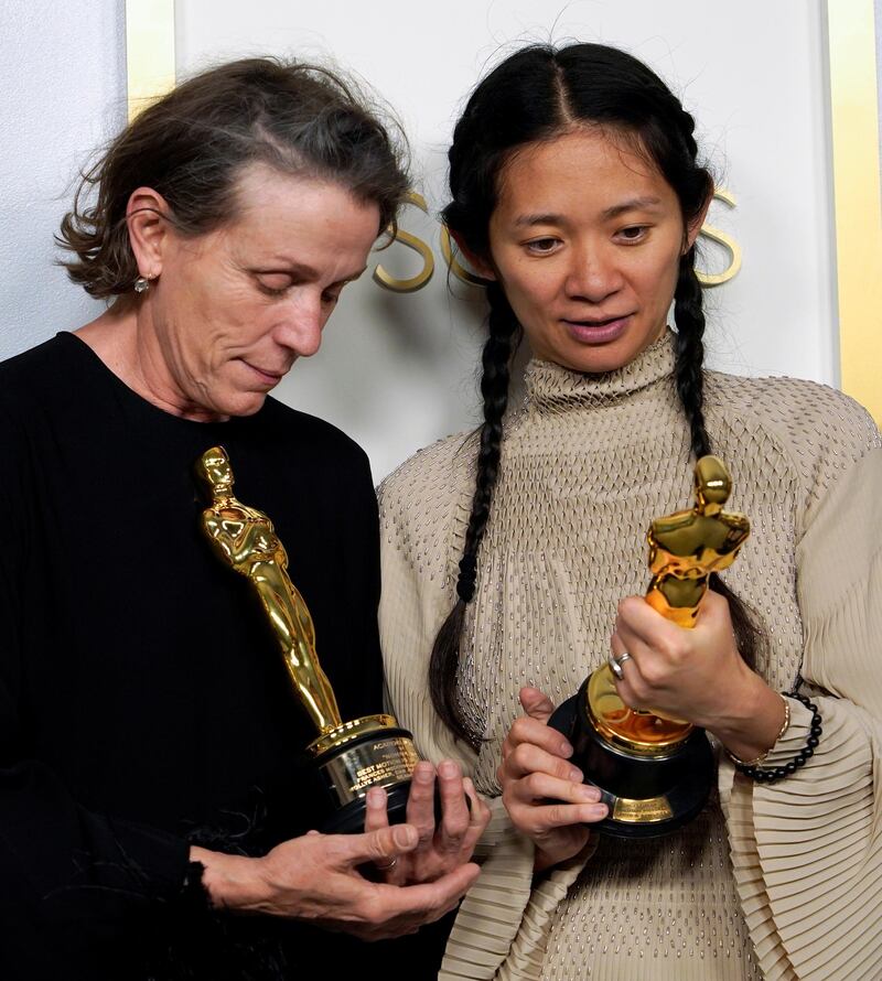 Frances McDormand and Chloe Zhao pose in the press room at the Academy Awards in Los Angeles, California. Reuters