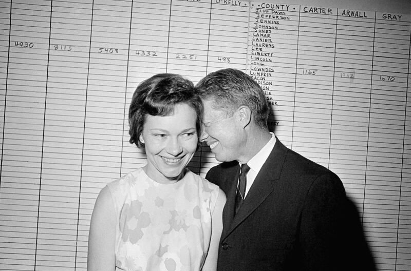 Then Georgia state senator Jimmy Carter with his wife at his Atlanta campaign headquarters in 1966. AP