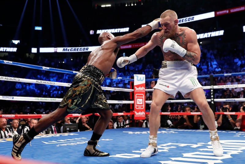 Floyd Mayweather in action with Conor McGregor. Reuters