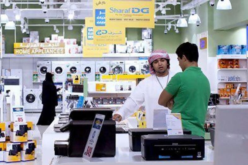 A new credit card from Emirates Islamic Bank offers rewards at retailers including Sharaf DG electronics stores. Christopher Pike / The National
