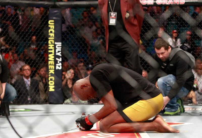 Anderson Silva kneels on the mat after beating Nick Diaz in their middleweight bout during UFC 183 in Las Vegas on Saturday night. Steve Marcus / Getty Images / AFP