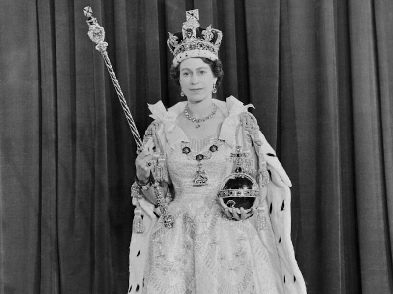 Queen Elizabeth II holding the royal sceptre after her coronation. Getty