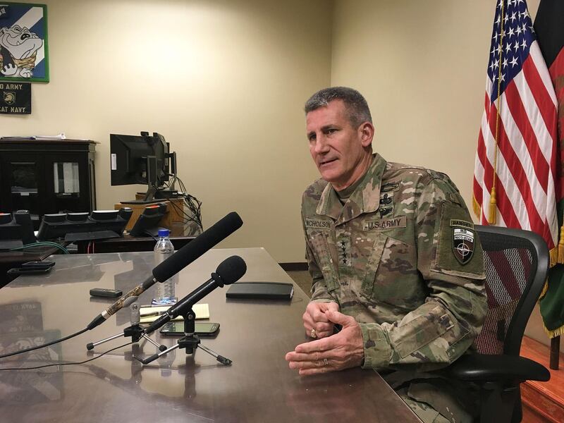 General John Nicholson, who leads US and NATO forces in Afghanistan, speaks to reporters at Bagram Air Base, about 60km north of the Afghan capital Kabul, on March 14, 2018.
The Taliban are reeling from increased air and ground offensives and may realise that now is their best moment to negotiate for peace, General John Nicholson, the top US general in Afghanistan, said March 14. / AFP PHOTO / Thomas WATKINS