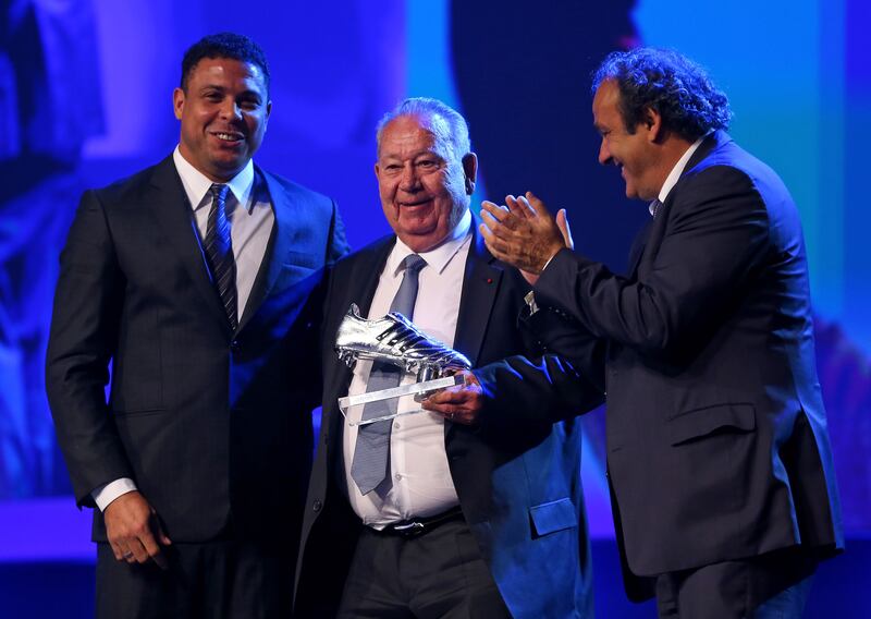 Former France international Just Fontaine receives the Adidas Platinum Boot award from former Brazil international Ronaldo and Uefa President Michel Platini in 2014. Getty 