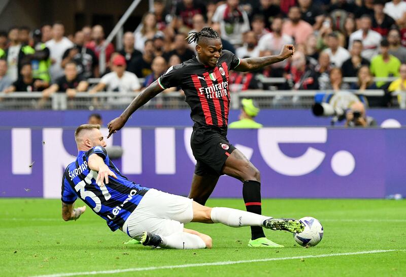 Inter Milan defender Milan Skriniar attempts to tackle Rafael Leao. AFP