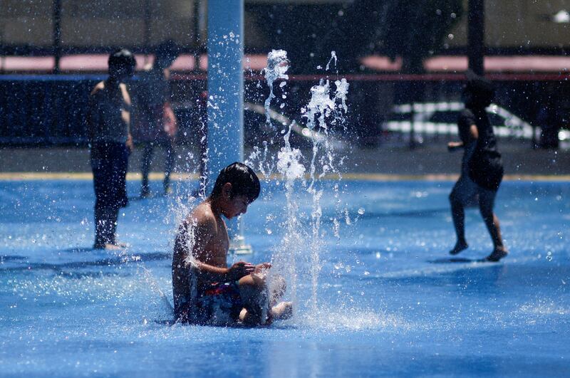 Children in a fountain during a heat wave in Concepcion, Chile, in January. Reuters