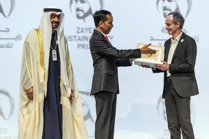 ABU DHABI, UNITED ARAB EMIRATES. 13 JANUARY 2020. The Zayed Sustainability Awards held at ADNEC as part of Abu Dhabi Sustainability Week. H.E. Sheikh Mohammed bin Zayed Al Nahyan, Crown Prince of Abu Dhabi and Deputy Supreme Commander of the United Arab Emirates Armed Forces awards Energy Winner: Electricians Without Borders, France. H.E. Joko Widodo, President of the Republic of Indonesia. (Photo: Antonie Robertson/The National) Journalist: Kelly Clarker. Section: National.


