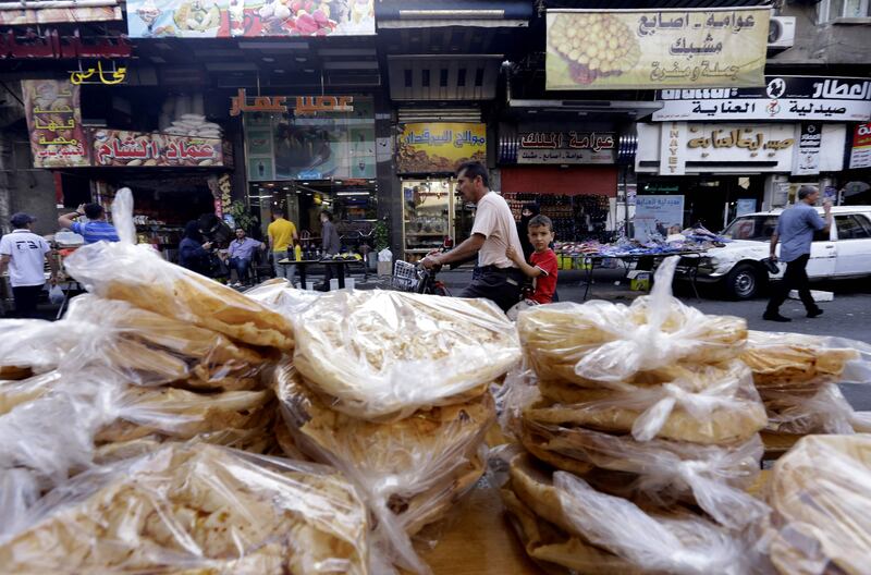 Piles of  bread for sale in Midan, a district of Damascus renowned for its sweet delicacies. AFP