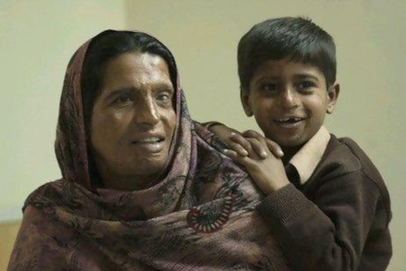 Mumtaz and her 7-year-old son, Mozam, live at the Acid Survivors Foundation in Islamabad. Adnan Khan