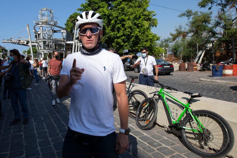 Lance Armstrong prepares to ride with Lebanese and foreign cyclists at the site of the August 4 deadly blast in the port of Beirut AP