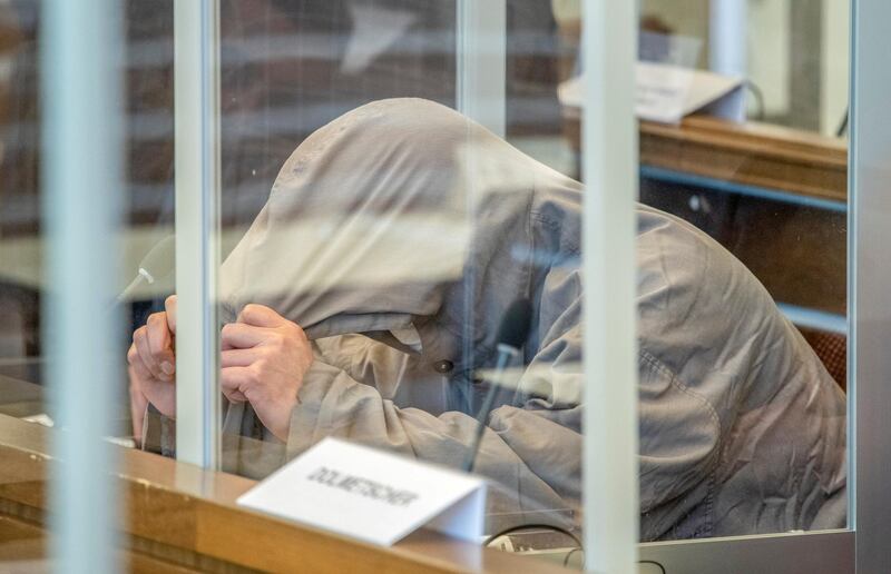 Syrian defendant Eyad A. arrives at a court for the first trial of suspected members of Syrian President Bashar al-Assad's security services for crimes against humanity, in Koblenz, Germany, April 23, 2020. Thomas Lohnes/Pool via REUTERS