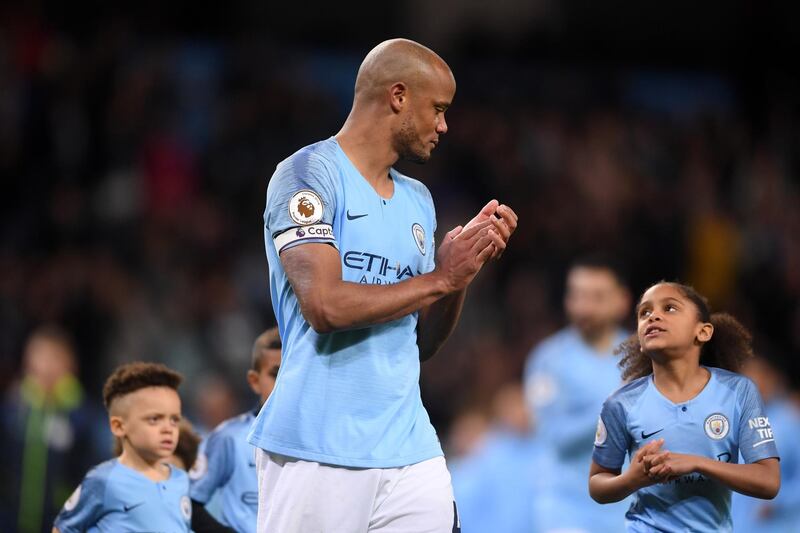 Vincent Kompany applauds the Manchester City supporters with his children. Getty Images