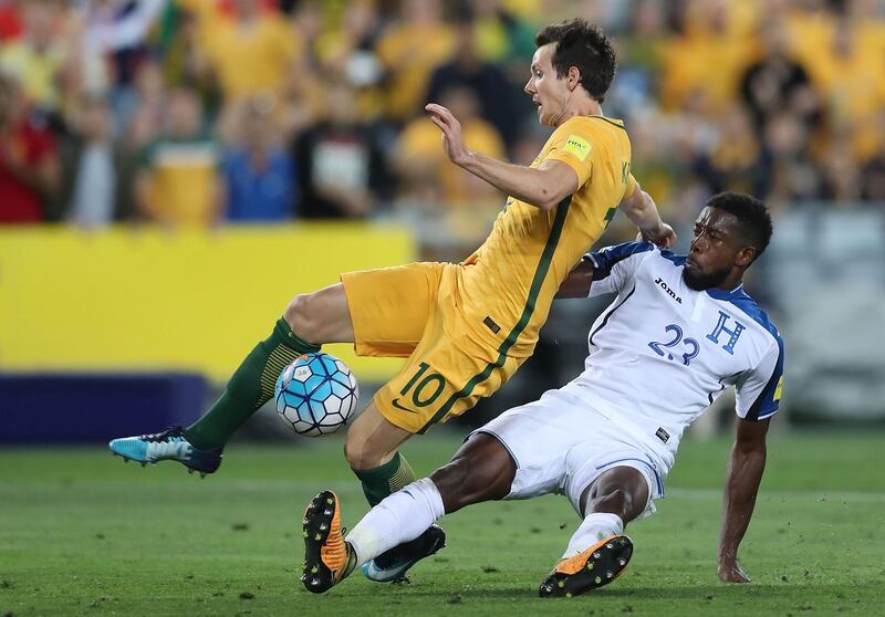Australia forward Robbie Kruse  is fouled by Johnny Palacios of Honduras for a penalty. Mark Metcalfe / Getty Images