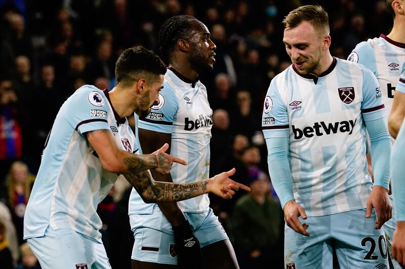 Manuel Lanzini, left, celebrates after scoring his side's third goal. PA