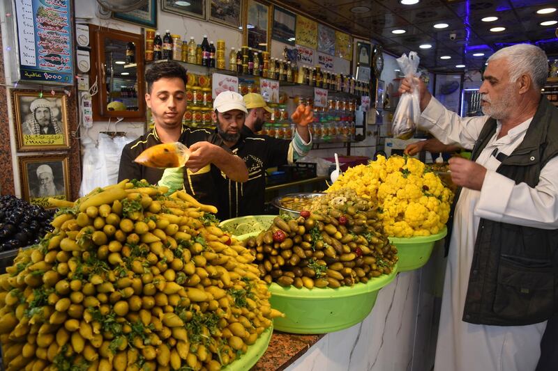 An Iraqi man buys pickles in Mosul, northern Iraq.  EPA