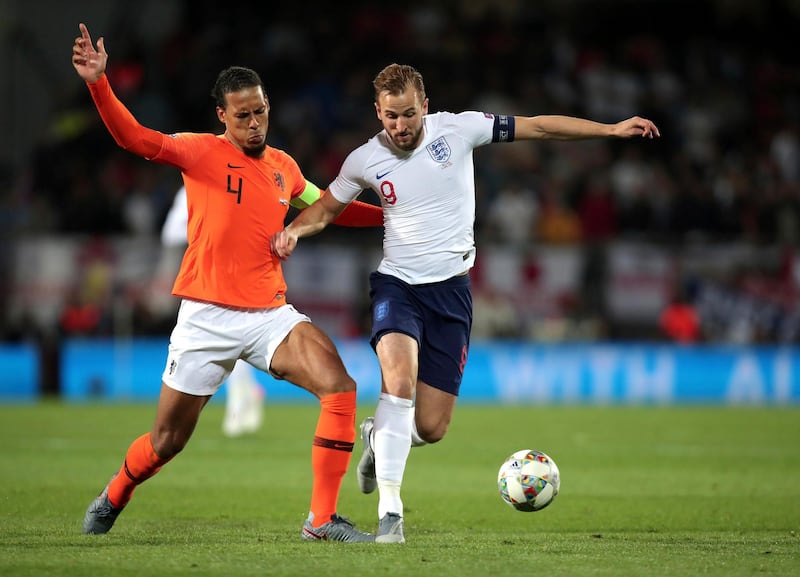 Netherlands' Virgil Van Dijk, left, duels for the ball with England's Harry Kane during the UEFA Nations League semi final between the Netherlands and England. AP Photo