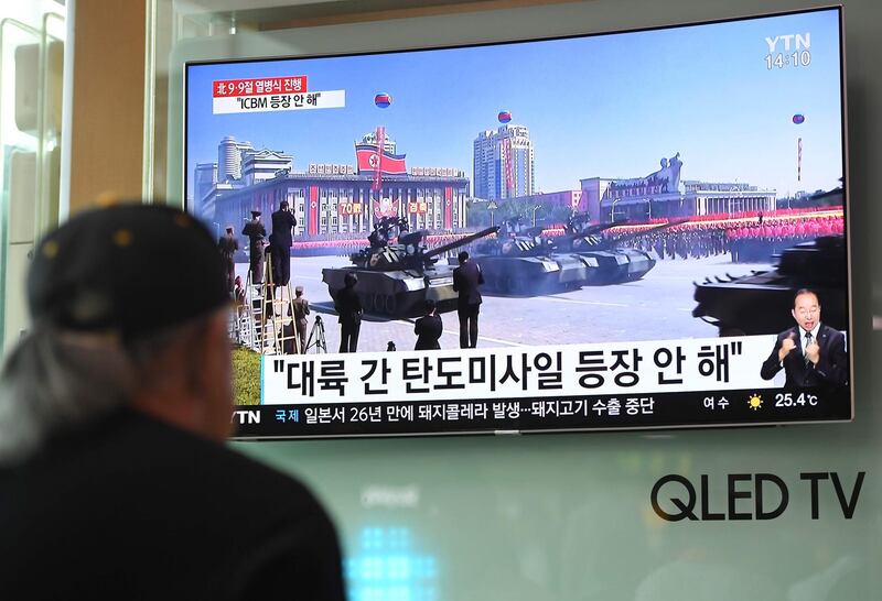 A man watches a television news reporting a parade marking the 70th anniversary of the foundation of North Korea held in Pyongyang.  AFP