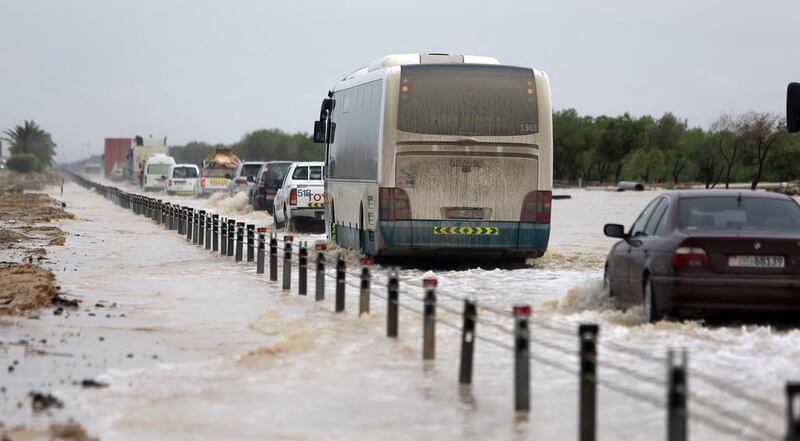 Heavy rains flood a section of the E11 near Ruwais forcing traffic to be diverted. Sammy Dallal / The National

