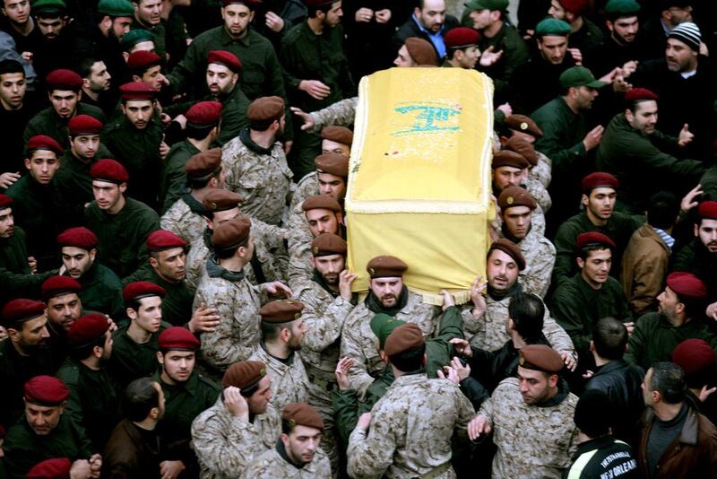 Hezbollah commandos carry the coffin of slain Hezbollah commander, Imad Mughnieh, during his funeral in the southern suburbs of Beirut on February 14, 2008. Mazen Akl / AFP