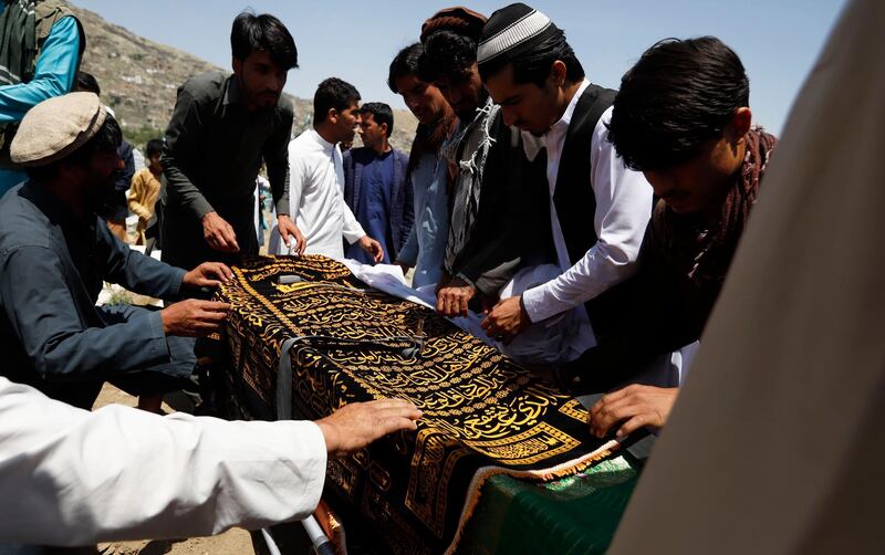 epa07564133 People carry the coffin of Afghan female journalist and political advisor Mena Mangal, a day after she was killed by unknown gunmen in downtown Kabul, Afghanistan, 12 May 2019. The 27-year-old prominent Afghan journalist and political adviser was shot dead in Kabul on 11 May, few days after she posted on social media that she is receiving threatening messages.  EPA/JAWAD JALALI