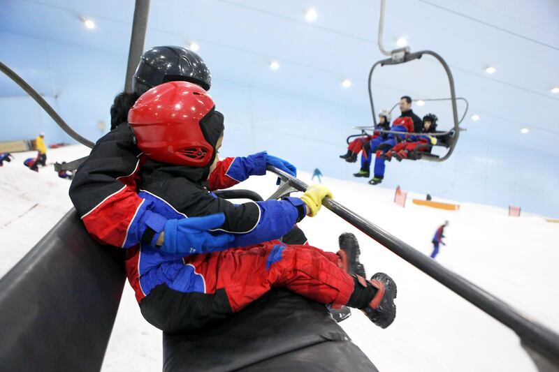 DUBAI , UNITED ARAB EMIRATES – Jan 20 : People enjoying at the Ski Dubai in Mall of the Emirates in Dubai. ( Pawan Singh / The National ) For Stock