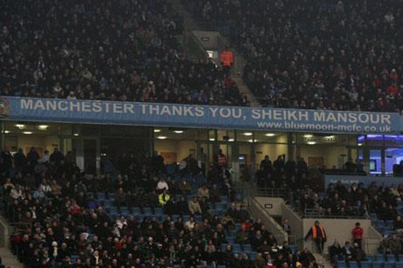 A banner at the City of Manchester Stadium shows the supporters' appreciation for the work on and off the field being undertaken by the club's Abu Dhabi owners.