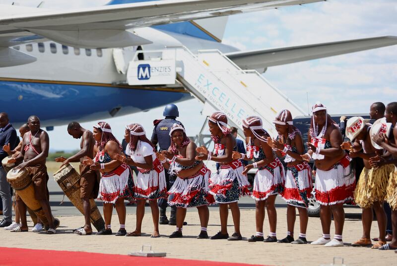 After flying all night, the first lady and her granddaughter were feted at the airport by members of some of Namibia’s ethnic groups. Reuters