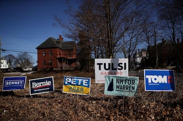 Yard signs for Democratic presidential candidates are posted in front of a home in Manchester, New Hampshire. AFP