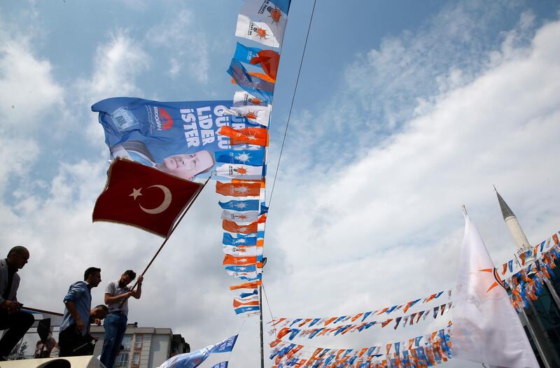 A man waves a Turkish flag during an election rally of Turkey's President Recep Tayyip Erdogan and his ruling Justice and Development Party, or AKP, in Istanbul, Turkey, on June 23, 2018. Lefteris Pitarakis / AP Photo