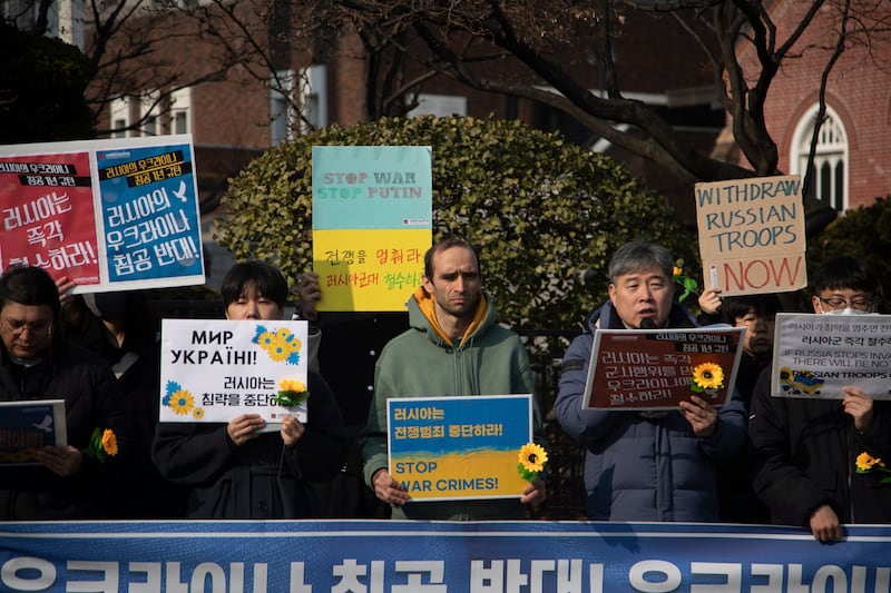 Protesters near the Russian embassy in Seoul, South Korea. EPA