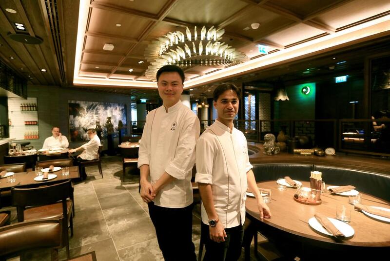 Dai Pai Dong’s head chef He Jia, left, and the Rosewood Abu Dhabi’s executive sous chef Siddharth Krishna. Ravindranath K / The National 

