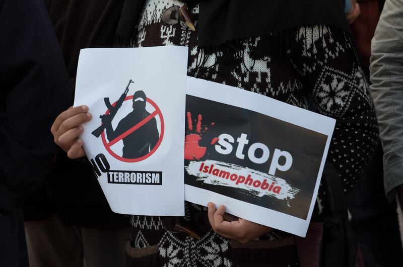 epa07443310 People carry banners and shout slogans during a protest against terrorist attacks on mosque in Christchurch, New Zealand, outside the Parliament building in Rabat, Morocco, 16 March 2019. On 15 March 2019, 49 people were killed by a gunman, believed to be Brenton Harrison Tarrant, and 20 more injured and in critical condition during the terrorist attacks against two mosques in New Zealand during the Friday prayers. Tarrant was charged by one murder charge with more to follow as the investigation continues. Arabic banners read 'No to Islamophobia under any name'.  EPA/JALAL MORCHIDI