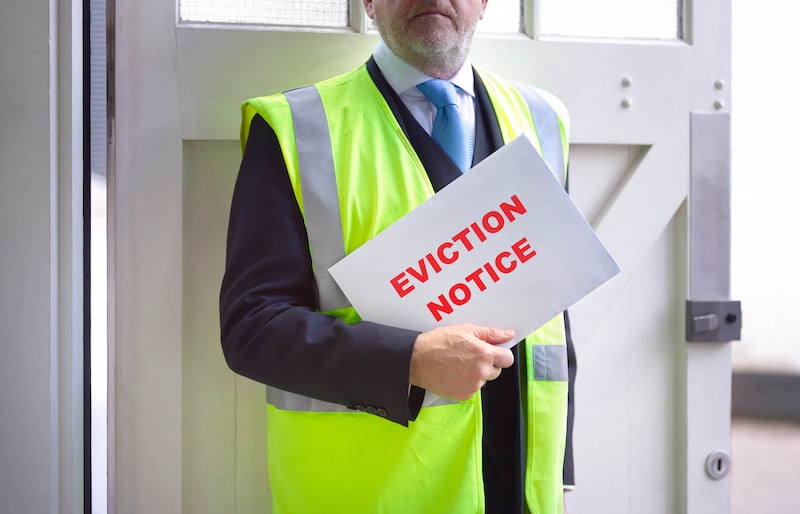 Eviction notice being delivered. Getty Images
