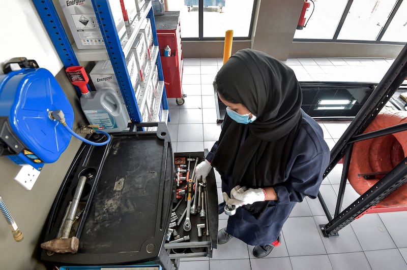 A Saudi woman mechanic at a repair and service garage in Saudi Arabia's Red Sea coastal city of Jeddah.  AFP