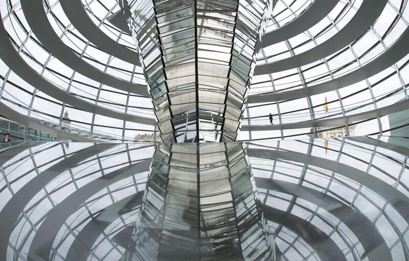 A visitor walks inside the cupola of the German Bundestag in Berlin.  Johannes Eisele / AFP Photo