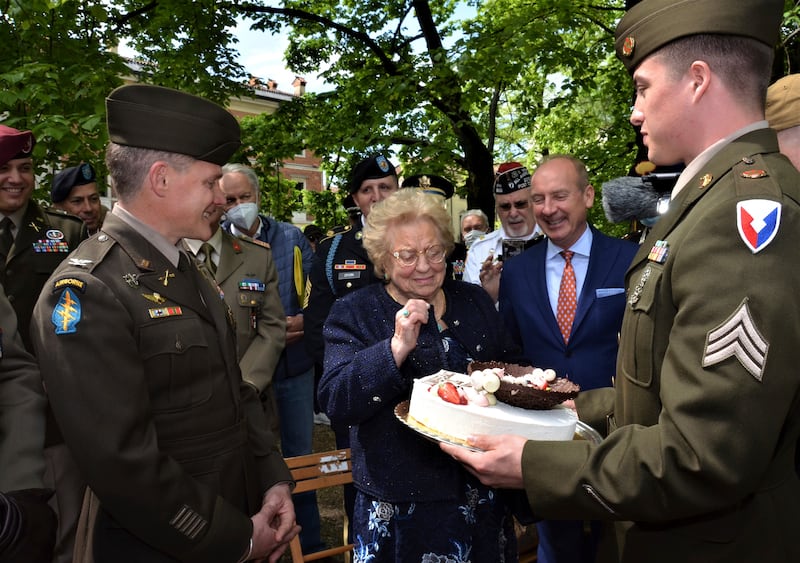 Soldiers from US Army Garrison Italy return a birthday cake to Meri Mion in Vicenza, northern Italy. Photo: US Army / AP