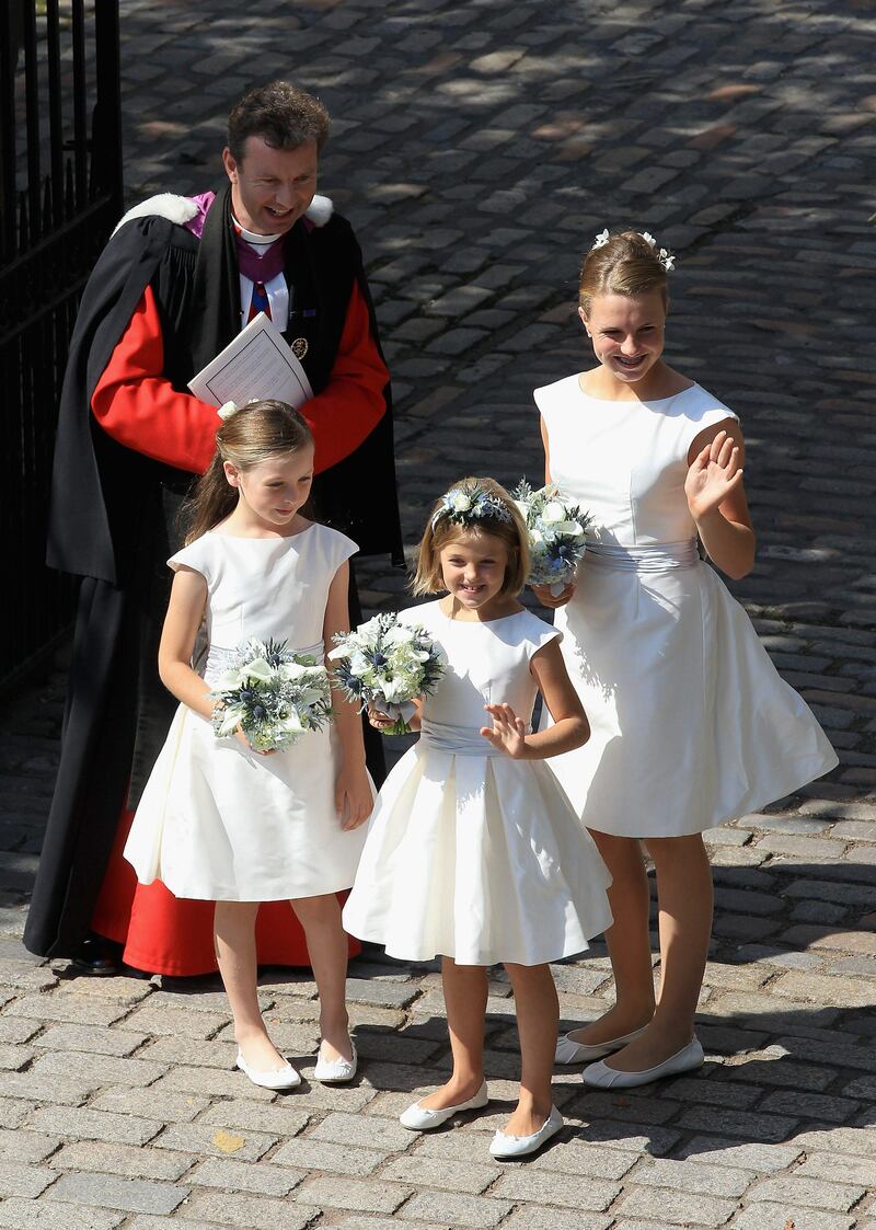 EDINBURGH, SCOTLAND - JULY 30:  Brides maids wave at Canongate Kirk on the afternoon of the wedding of Mike Tindall and Zara Philips on July 30, 2011 in Edinburgh, Scotland. The Queen's granddaughter Zara Phillips will marry England rugby player Mike Tindall today at Canongate Kirk. Many royals are expected to attend including the Duke and Duchess of Cambridge.  (Photo by Chris Jackson PT/Getty Images) *** Local Caption ***  120098277.jpg