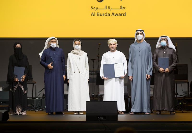 Winners of the Nabati Poetry category with Noura Al Kaabi, the UAE's Minister of Culture and Youth, at Al Burda Award ceremony at Expo 2020 Dubai.