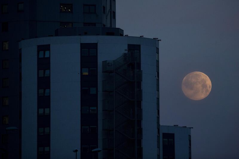 The supermoon hangs low in the sky in Barcelona, Spain. EPA