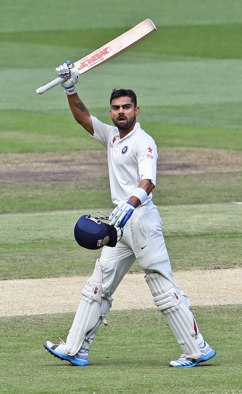 Virat Kohli celebrates after scoring a century against Australia in the 2014 Melbourne Test. It was the series in which he established himself as an all-format batting behemoth. AFP