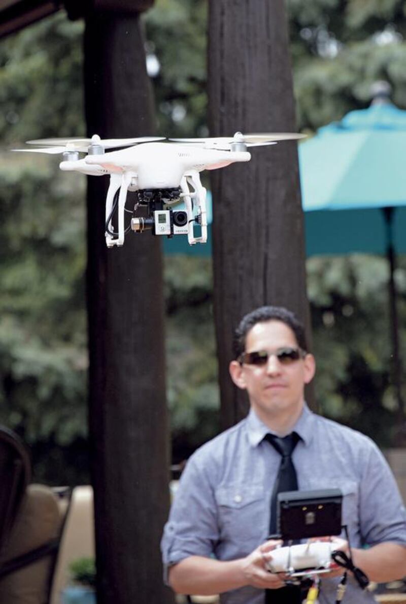 Brian Tercero, of Keller Williams Realty, uses a drone to create a high definition video of a property that he is trying to sell for a client, April 18, 2014.  He fells Video footage from a drone can better convey the appeal of a property than standard marketing photos.  The Santa Fe New Mexican, Clyde Mueller / AP photo 