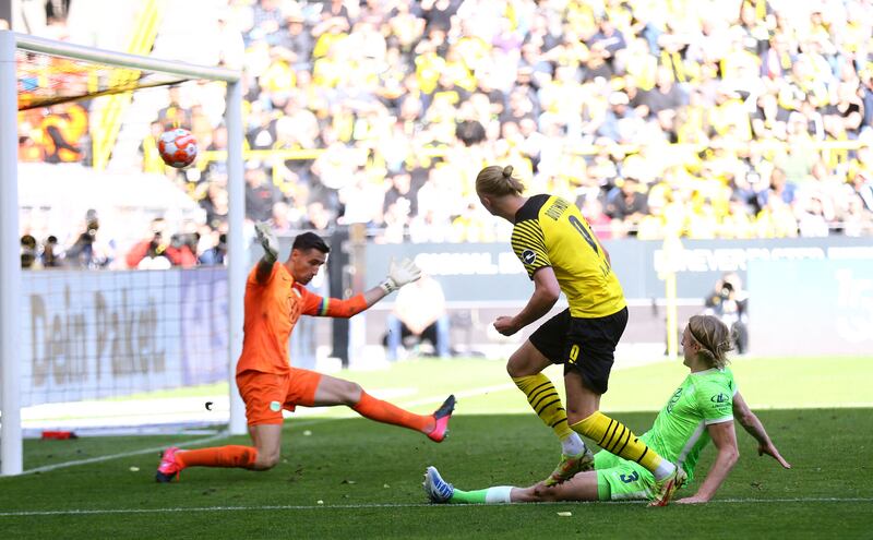 Borussia Dortmund's Erling Haaland scores against Wolfsburg in the Bundesliga in April, 2022. Reuters