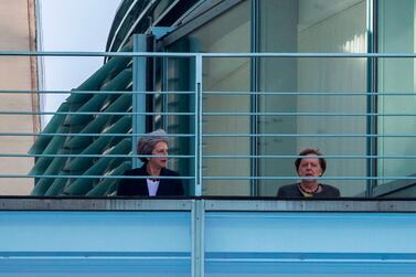 German Chancellor Angela Merkel (R) and British Prime Minister Theresa May speak on the terrasse at the Chancellery in Berlin on April 9, 2019. Embattled British Prime Minister Theresa May is visiting Berlin on April 9, 2019 for talks with German Chancellor Angela Merkel before travelling to Paris. / AFP / John MACDOUGALL