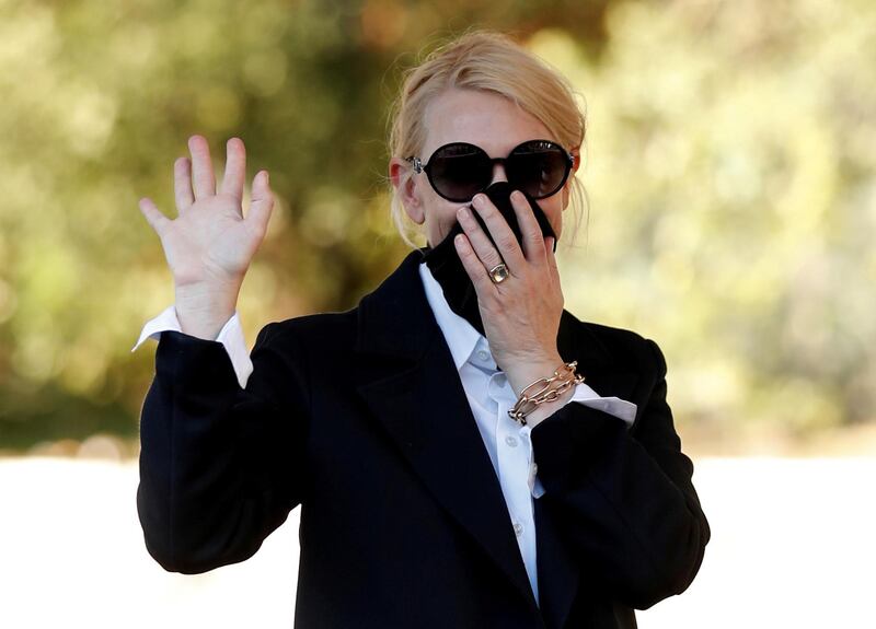 Cate Blanchett waves while covering her face as she arrives the day before the start of the 77th Venice International Film Festival on September 1, 2020. Reuters