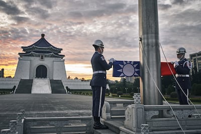 An honour guard during a flag raising ceremony at Chiang Kai-shek Memorial Hall in Taipei on Wednesday. Bloomberg